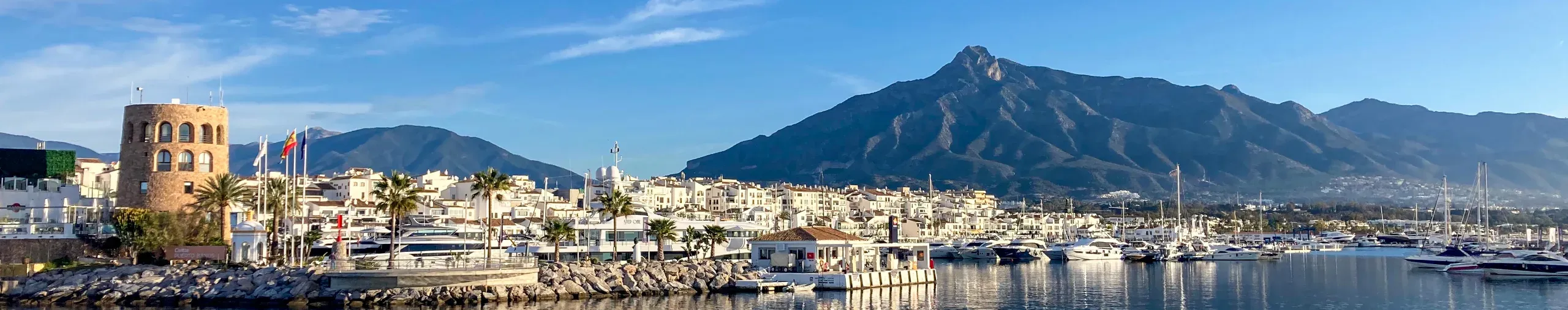 Yachts in Marbella marina at sunrise. 