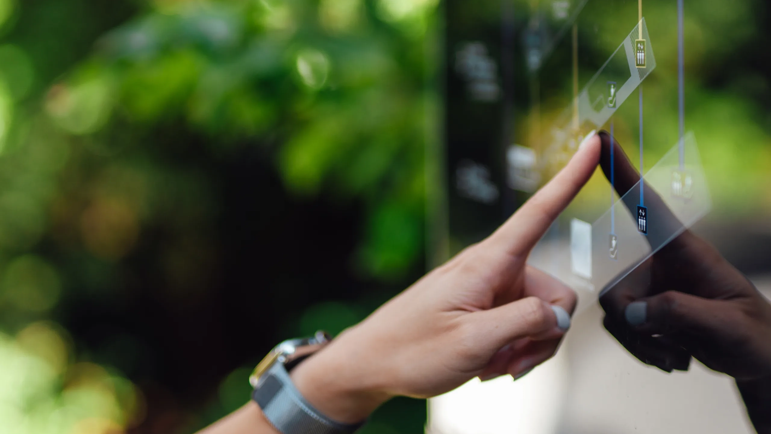 Female hand touching digital display screen
