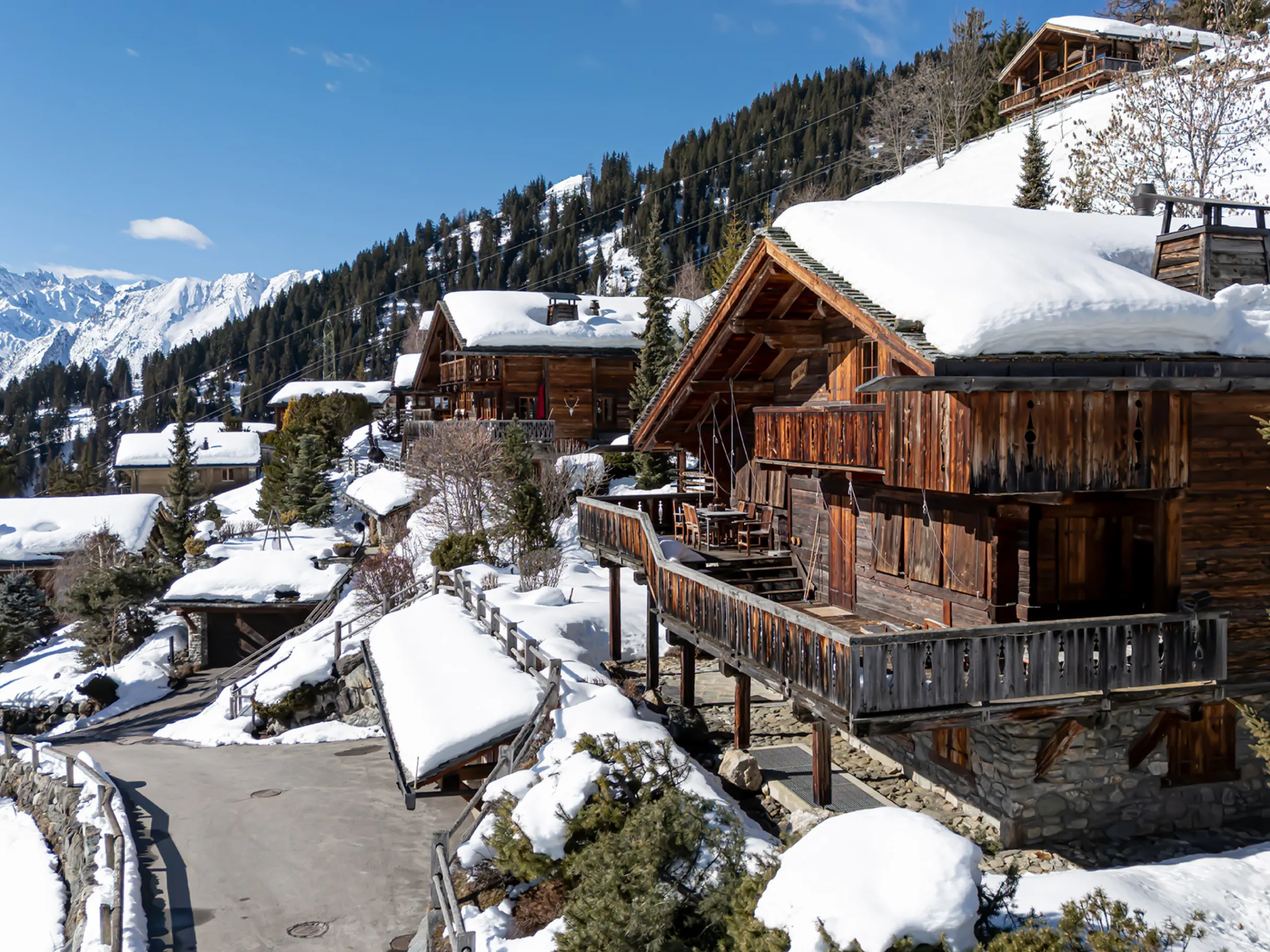 View across snowy mountains and chalets in Verbier