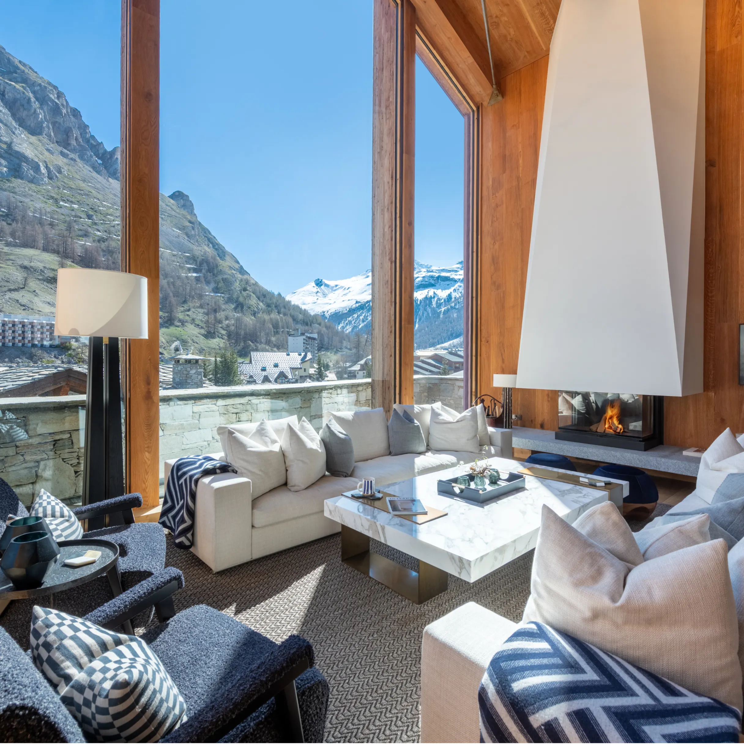 Modern, light-filled living room with mountain views outside