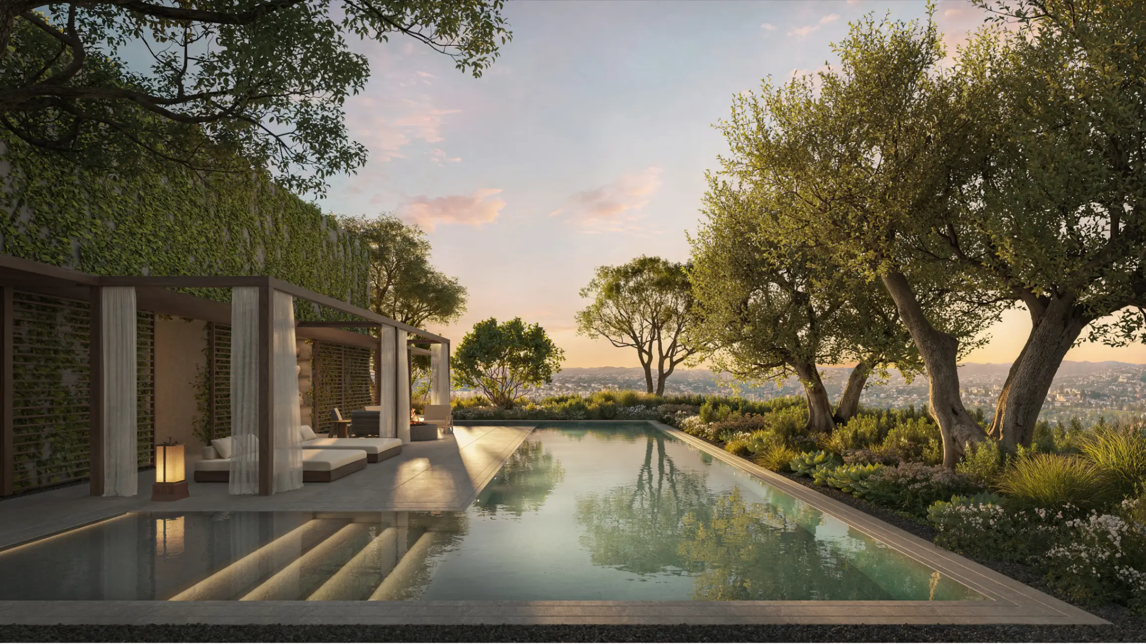 Sunset view of an upscale swimming pool surrounded by trees at the penthouse of One Beverly Hills