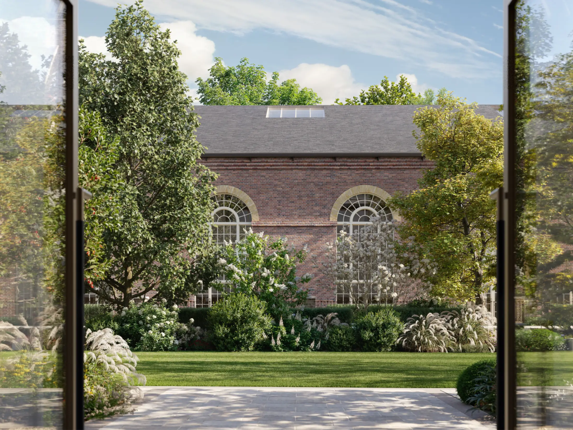 The sunny, lush gardens outside the St John's Wood Square Riding School